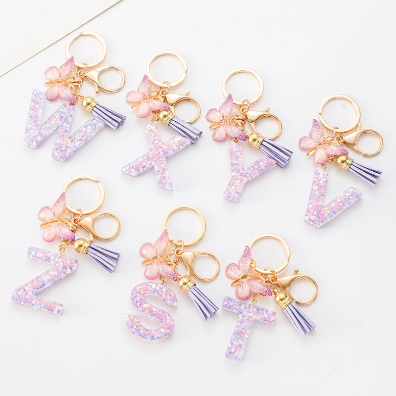 Pendentif lettre papillon Kuschelwohl™ avec pompon – Coloré et personnalisé (Vente de Noël 🎄)