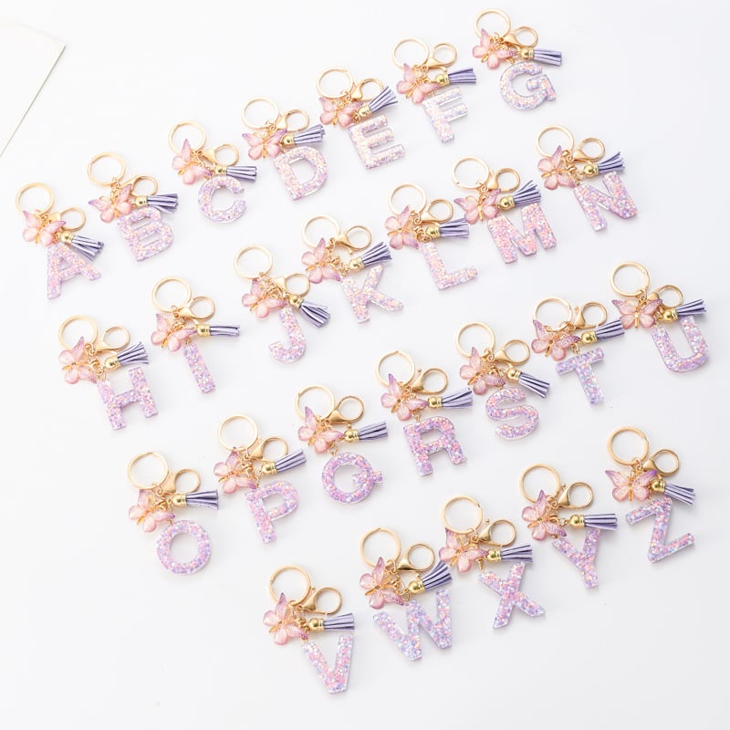 Pendentif lettre papillon Kuschelwohl™ avec pompon – Coloré et personnalisé (Vente de Noël 🎄)