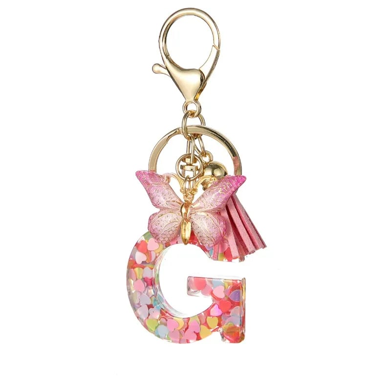 Pendentif lettre papillon Kuschelwohl™ avec pompon – Coloré et personnalisé (Vente de Noël 🎄)
