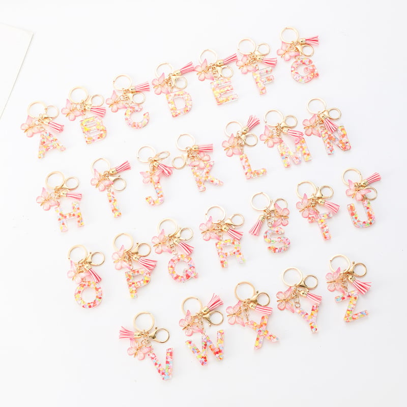 Pendentif lettre papillon Kuschelwohl™ avec pompon – Coloré et personnalisé (Vente de Noël 🎄)