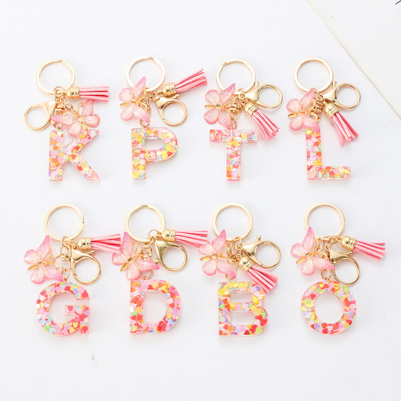 Pendentif lettre papillon Kuschelwohl™ avec pompon – Coloré et personnalisé (Vente de Noël 🎄)