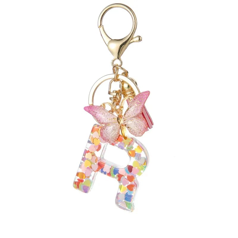 Pendentif lettre papillon Kuschelwohl™ avec pompon – Coloré et personnalisé (Vente de Noël 🎄)