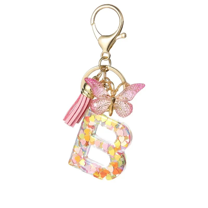 Pendentif lettre papillon Kuschelwohl™ avec pompon – Coloré et personnalisé (Vente de Noël 🎄)