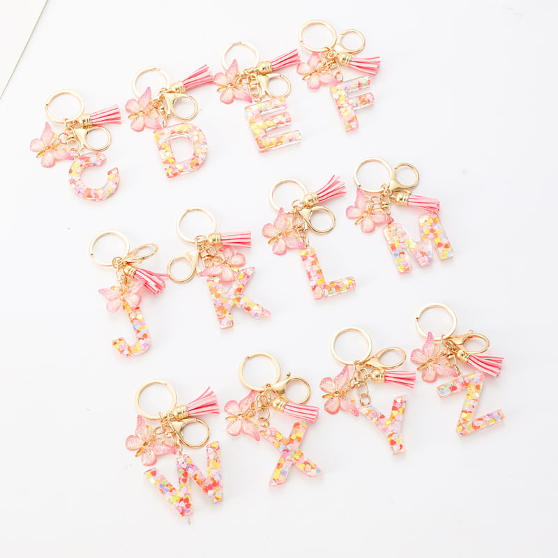 Pendentif lettre papillon Kuschelwohl™ avec pompon – Coloré et personnalisé (Vente de Noël 🎄)